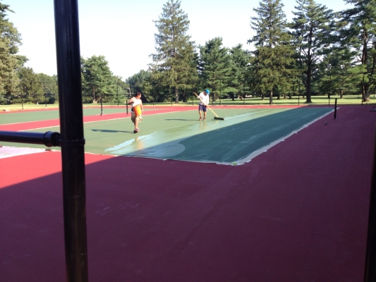 Addison tennis court being sealed.
